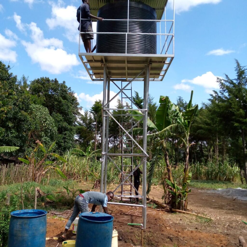 Water tower construction in progress to provide clean, reliable water for students.
